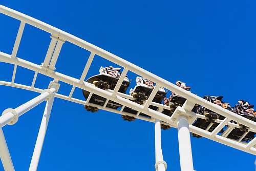 coney island low-angle photo of people riding on roller coaster rollercoaster